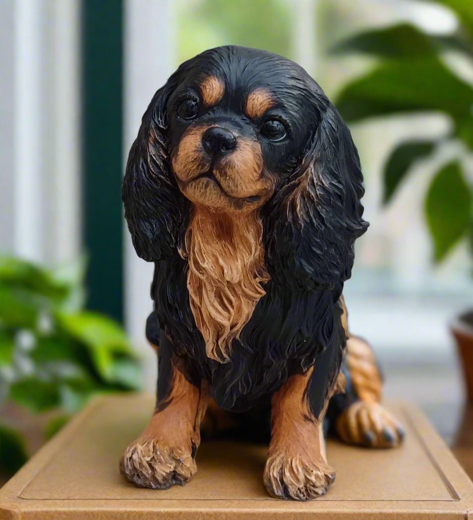 figurine of a black and tan cavalier king charles spaniel