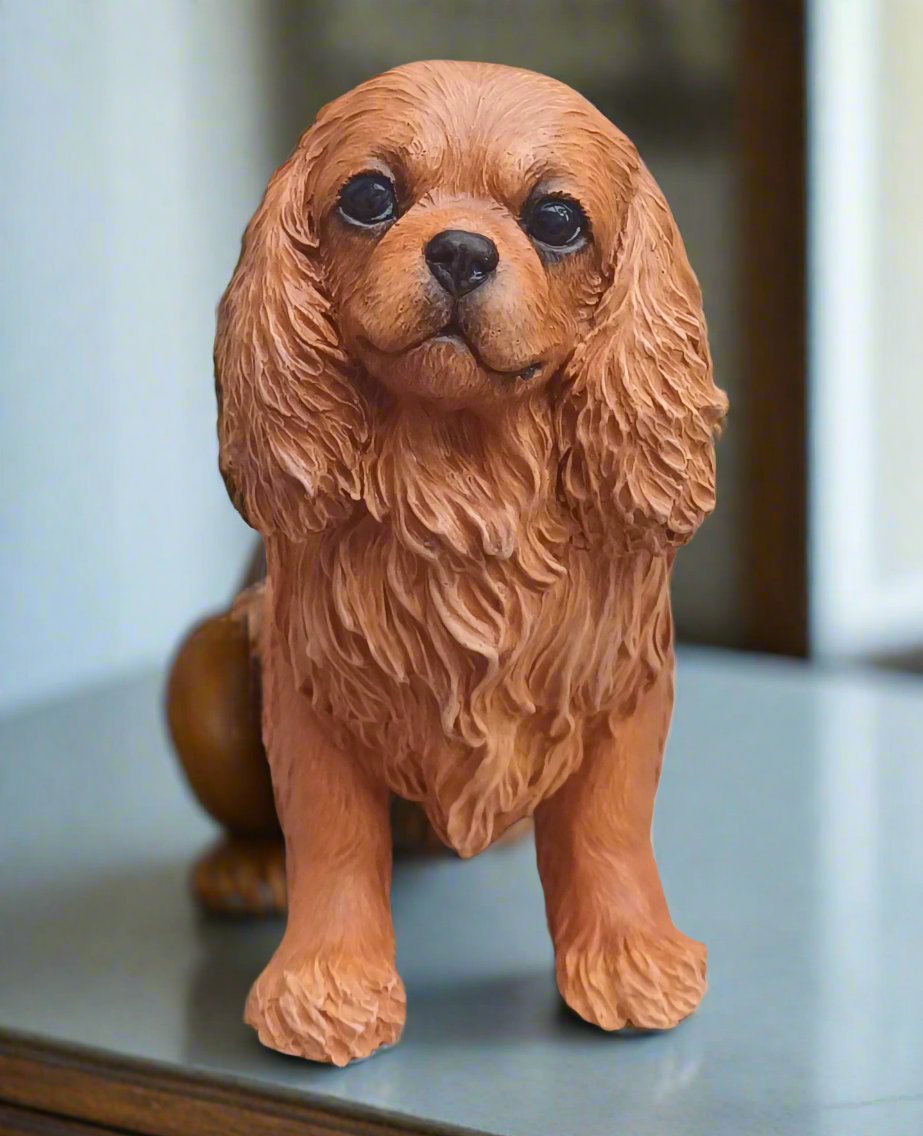 figurine of a ruby cavalier king charles spaniel