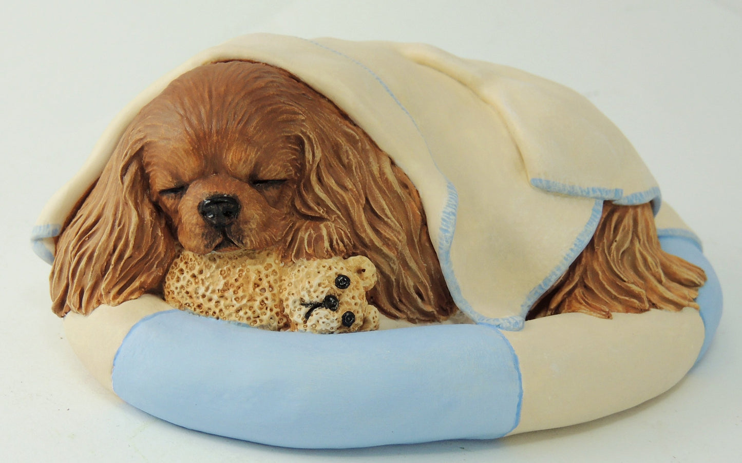 Sculpture Of A Cavalier King Charles Spaniel Wrapped in a Blanket